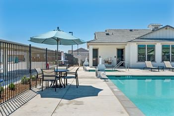 Resort style pool deck with heated spa